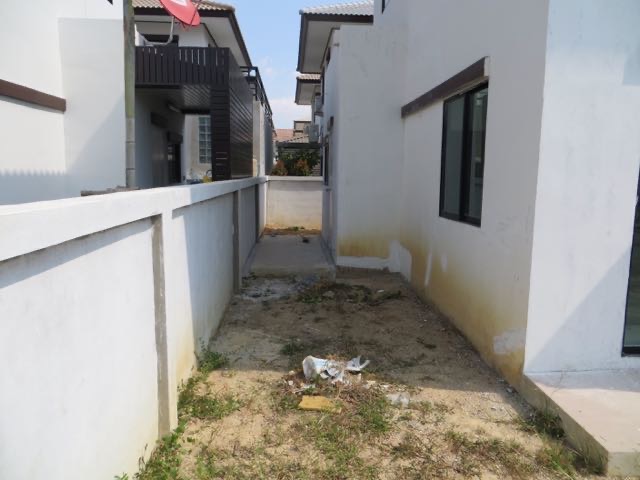 Back area before changes. Now an interior space connecting the new bonus room and Thai style kitchen.